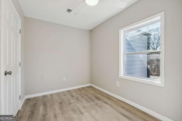 spare room with light wood-type flooring