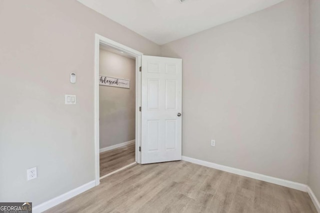 unfurnished bedroom with light wood-type flooring