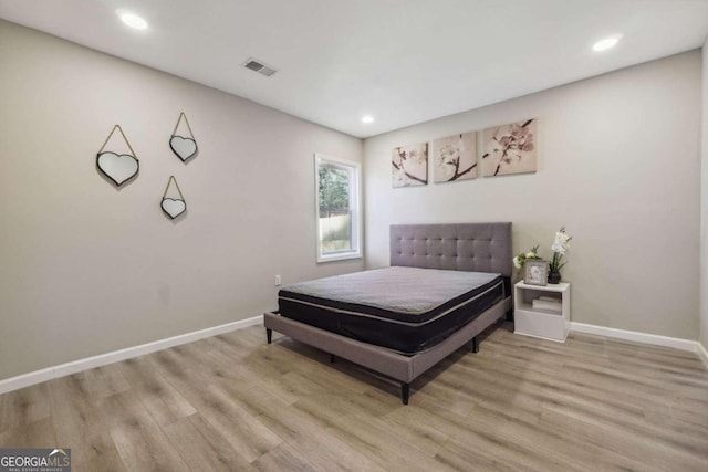 bedroom with light hardwood / wood-style floors