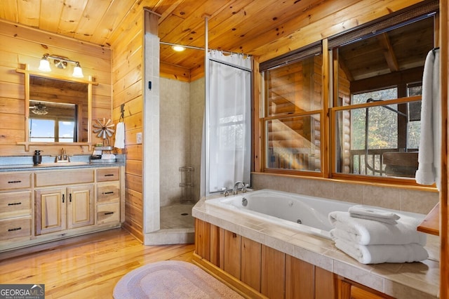 bathroom featuring vanity, shower with separate bathtub, wooden ceiling, hardwood / wood-style floors, and wood walls