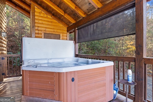 deck with a hot tub