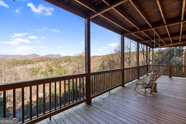 wooden terrace with a mountain view