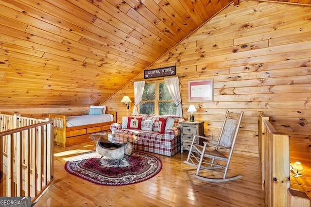 living room featuring lofted ceiling, light wood-type flooring, wooden walls, and wooden ceiling