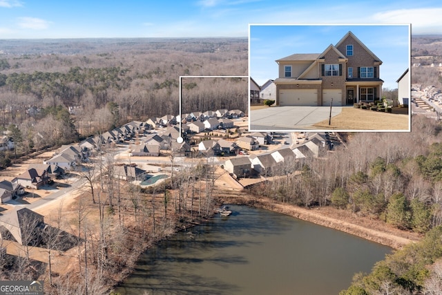 birds eye view of property featuring a water view