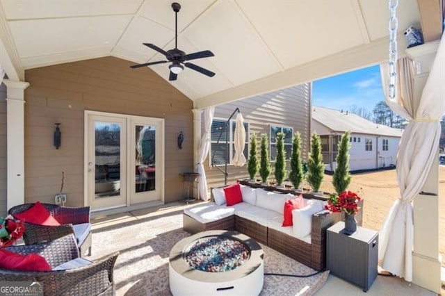 view of patio with an outdoor living space and ceiling fan