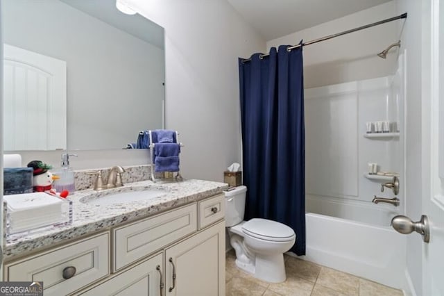 full bathroom featuring vanity, shower / bath combination with curtain, tile patterned floors, and toilet