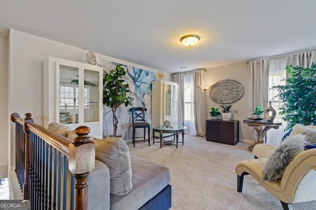 living room featuring light carpet