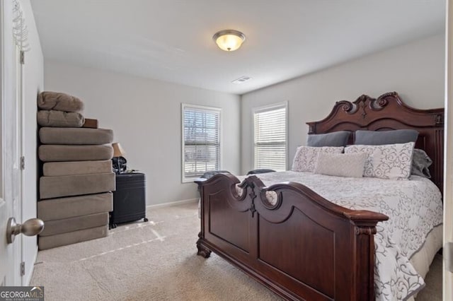 bedroom featuring light colored carpet