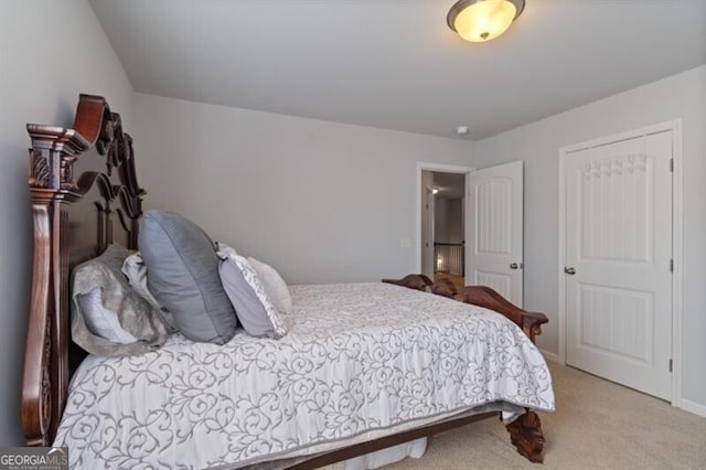 bedroom featuring vaulted ceiling and light carpet