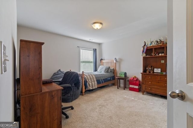 bedroom featuring light colored carpet