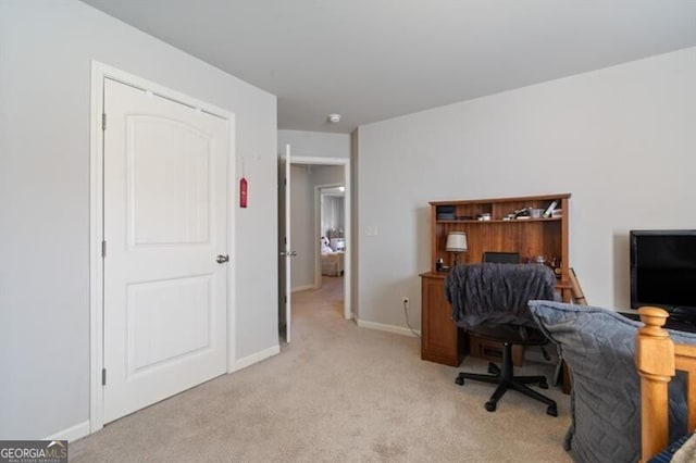 office area featuring light colored carpet