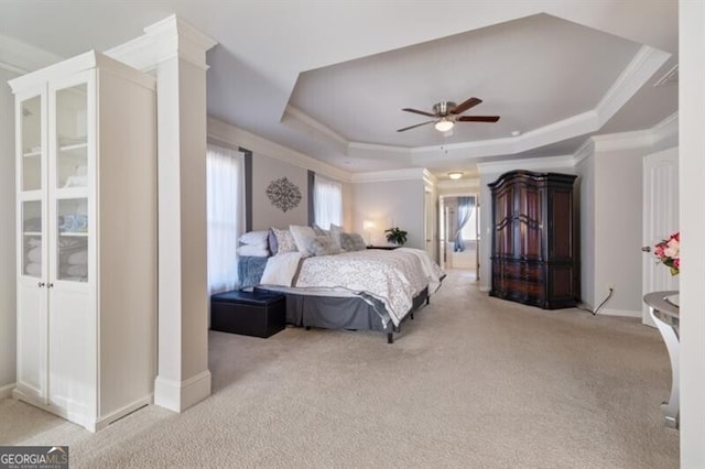 bedroom featuring multiple windows, crown molding, light carpet, and a raised ceiling