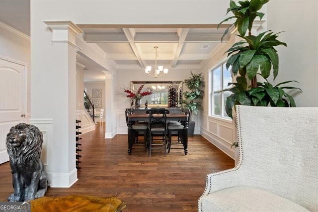 dining space featuring coffered ceiling, ornamental molding, dark hardwood / wood-style flooring, and beamed ceiling