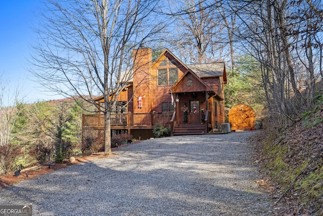 view of front of property with central AC and a deck