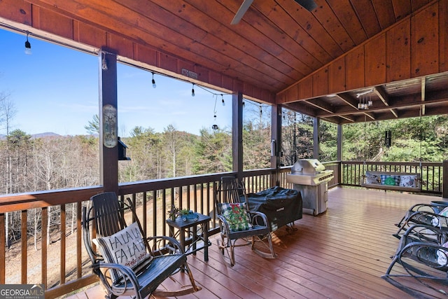 wooden terrace with area for grilling