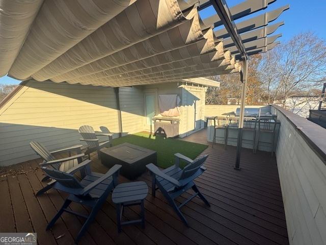 deck featuring a pergola