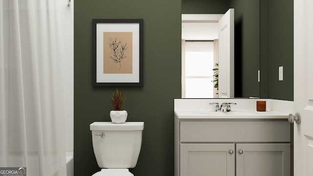 bathroom featuring vanity and toilet