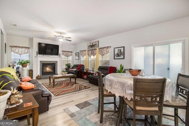 dining space featuring ceiling fan and light hardwood / wood-style floors