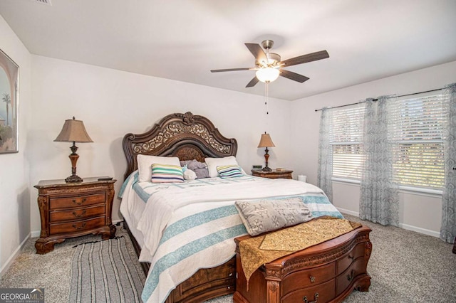 bedroom featuring ceiling fan and light colored carpet