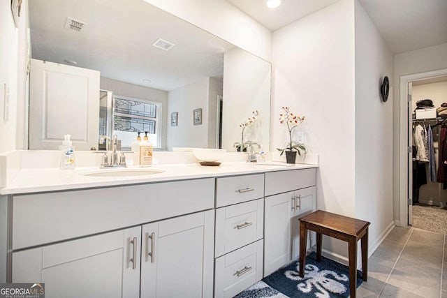 bathroom featuring tile patterned floors and vanity