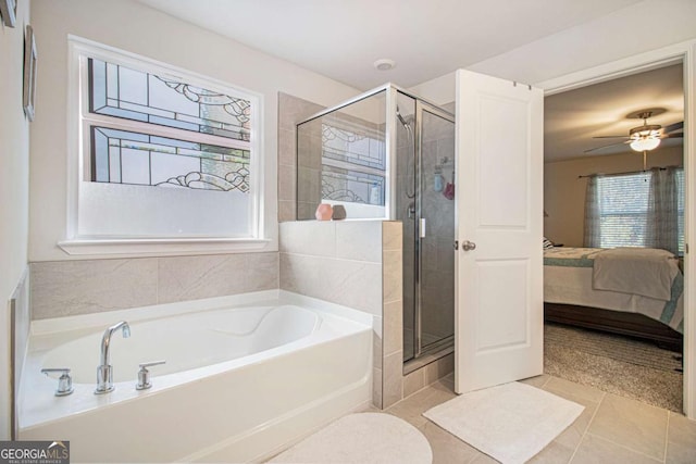 bathroom featuring ceiling fan, independent shower and bath, and tile patterned flooring