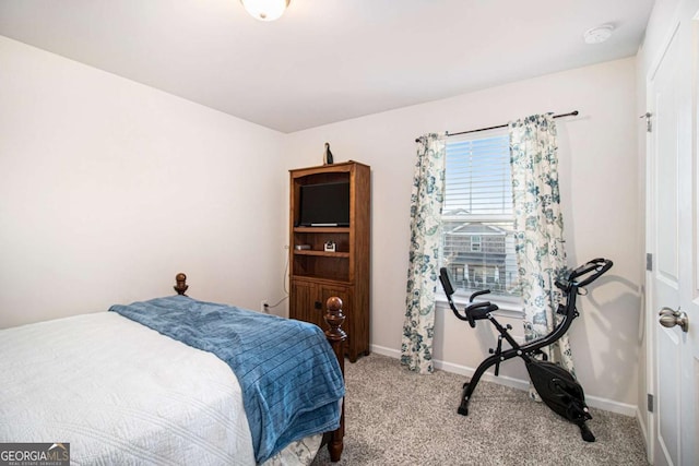 bedroom featuring light carpet