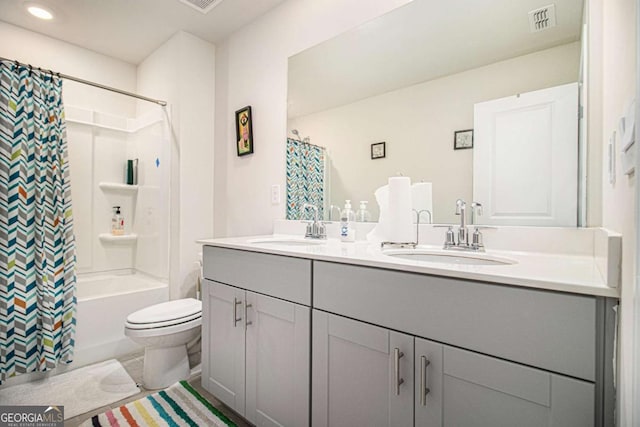 full bathroom with shower / bath combo with shower curtain, toilet, and vanity