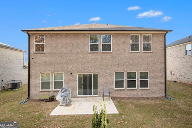 rear view of house with central AC unit, a yard, and a patio