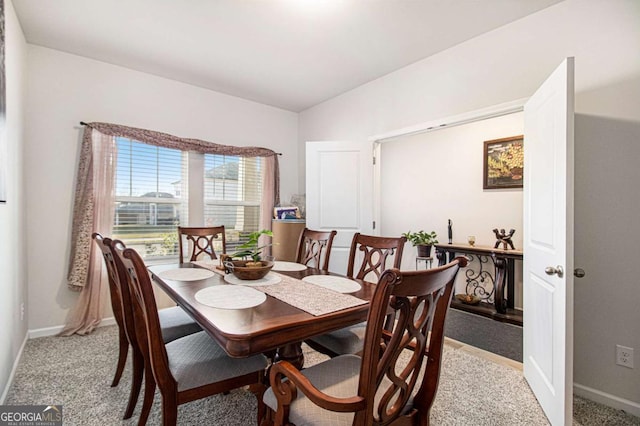 dining area with light colored carpet