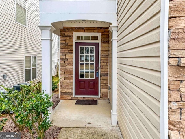 doorway to property with central air condition unit