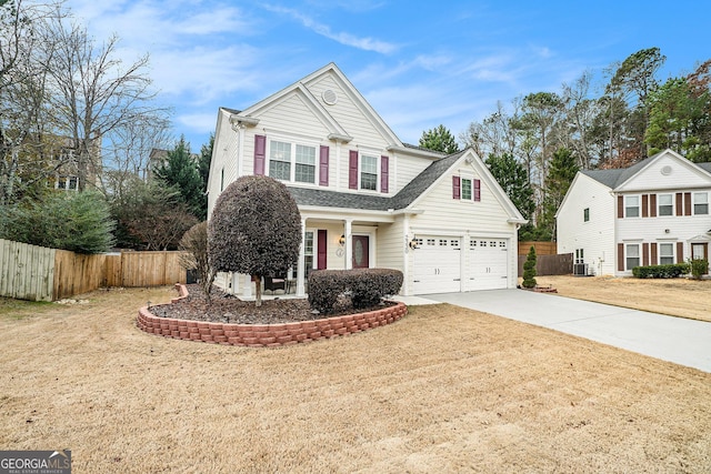 view of front property with a garage and cooling unit