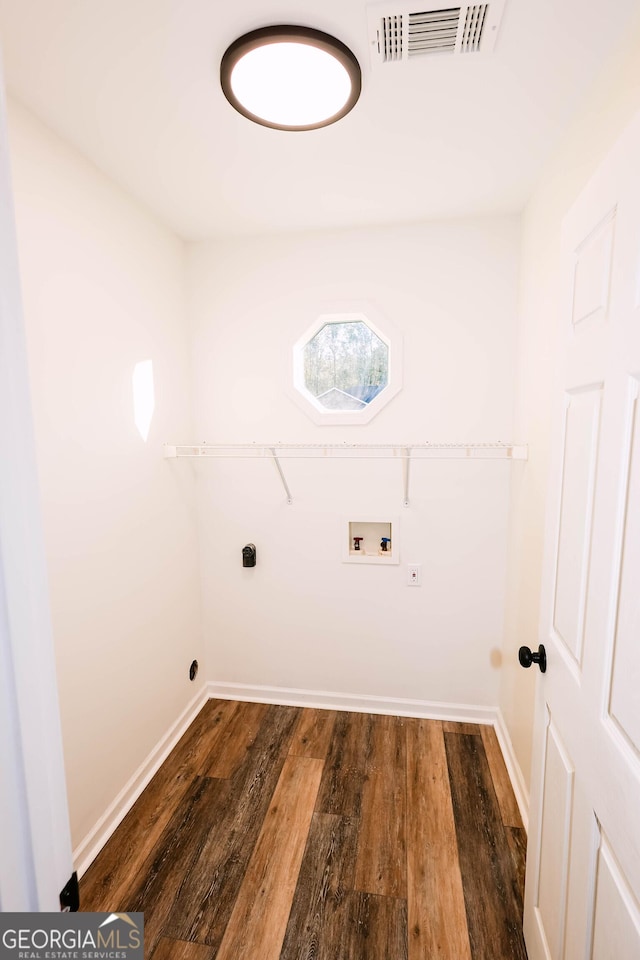 laundry area with electric dryer hookup, dark hardwood / wood-style floors, and hookup for a washing machine