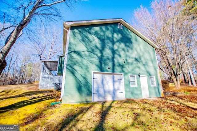 view of property exterior with a lawn and a sunroom