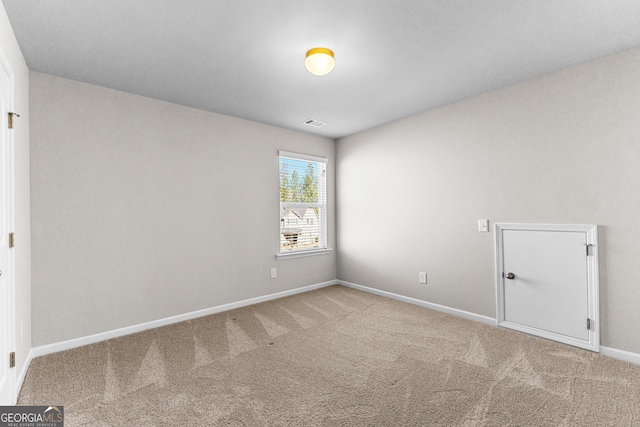 spare room featuring carpet flooring