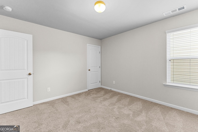 view of carpeted spare room