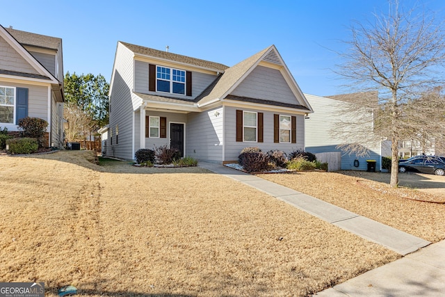 view of front property with central AC unit