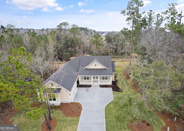 bird's eye view featuring a forest view