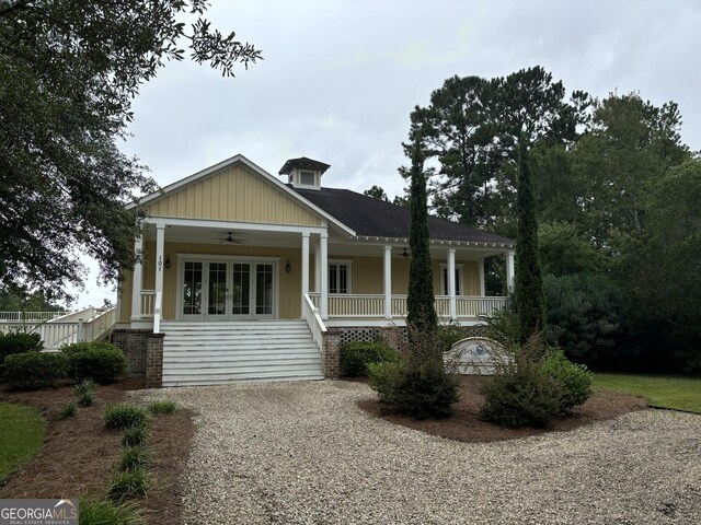 birds eye view of property featuring a wooded view