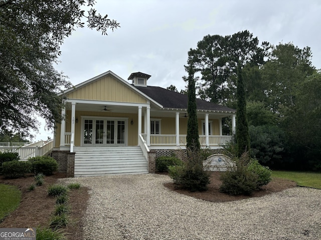 view of front of house featuring ceiling fan and a porch