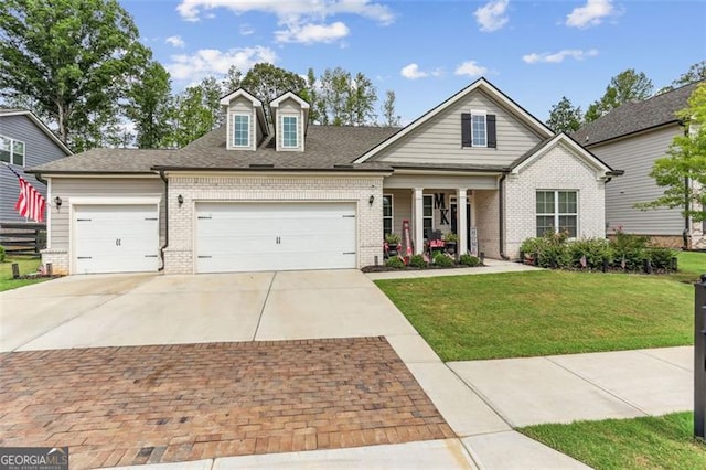 view of front facade with a garage and a front yard