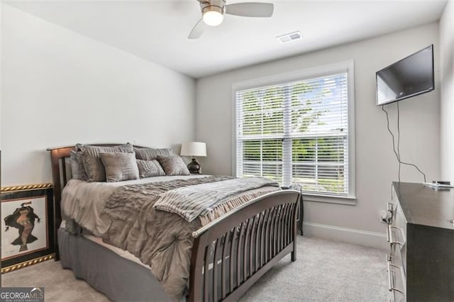 bedroom with light carpet and ceiling fan