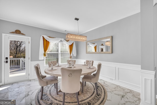 dining area with crown molding