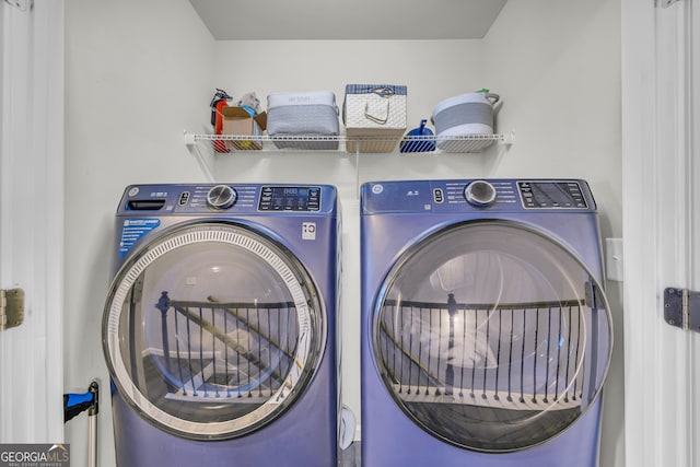 laundry area with separate washer and dryer