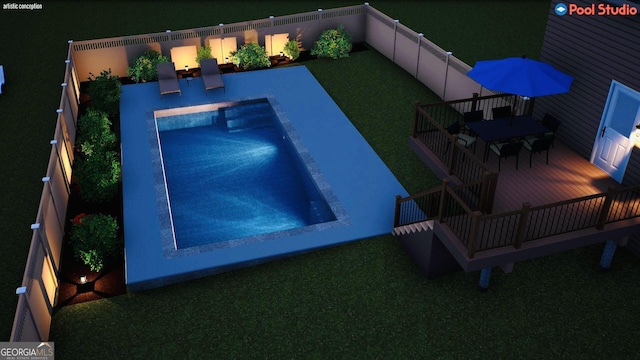 view of swimming pool with a wooden deck and a yard