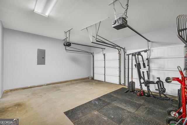 garage with a garage door opener and electric panel