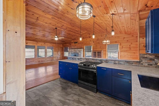 kitchen featuring ceiling fan, blue cabinets, hanging light fixtures, and stainless steel stove