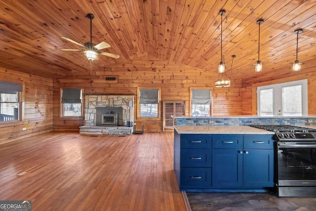 kitchen with light stone countertops, gas stove, wooden ceiling, hanging light fixtures, and lofted ceiling