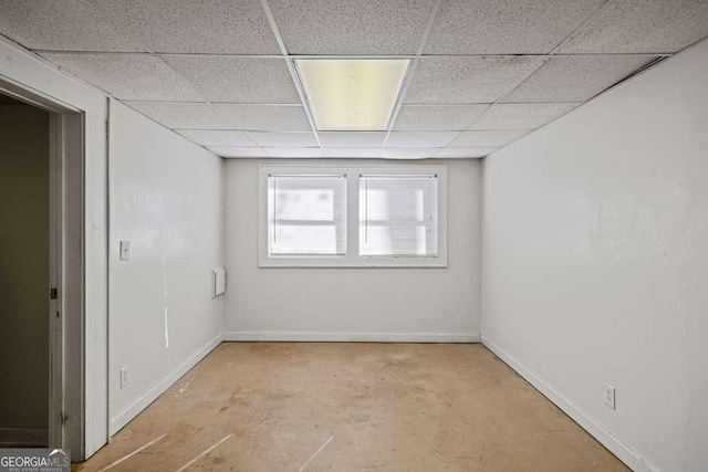 empty room featuring a drop ceiling