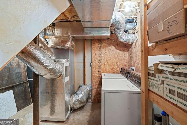 clothes washing area featuring independent washer and dryer