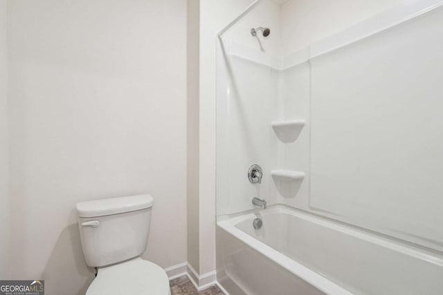 bathroom with toilet and tub / shower combination